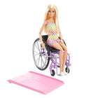 Barbie Fashionista wearing a rainbow dress with a wheelchair and ramp