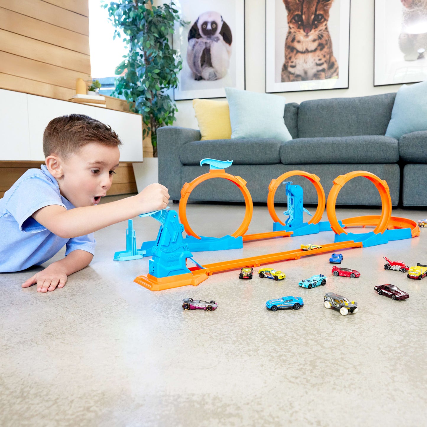 Hot Wheels tracks and connectors with three loops, including a car